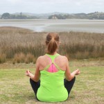 Donna-sitting-yoga-on-the-beach